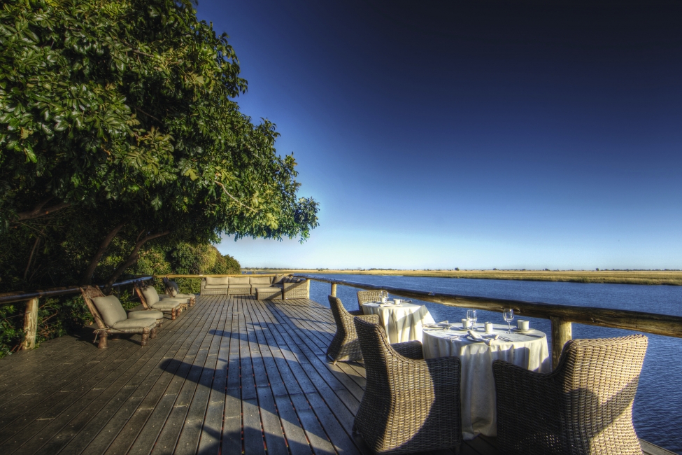 Tables on the riverside terrace, Chobe Game Lodge
